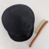 black cap with hat brush