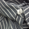 Artisan Custom Minimalist Silver CZ Apparel Button is shown on the striped shirt.