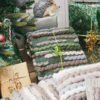 Handwoven 'Caterpillar' throw featuring Merino wool by Cassandra Sabo wrapped under the Christmas tree