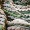 Close-up texture detail of the Handwoven 'Caterpillar' throw featuring Merino wool by Cassandra Sabo