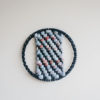 Cassandra Sabo’s ‘West Coast 8’ woven circular textile artwork from her West Coast Collection