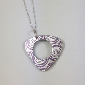Purple side of triangular suffragette pendant necklace with hole in the middles and silver chain