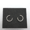 Circle Wire Stud Earrings on a black sponge